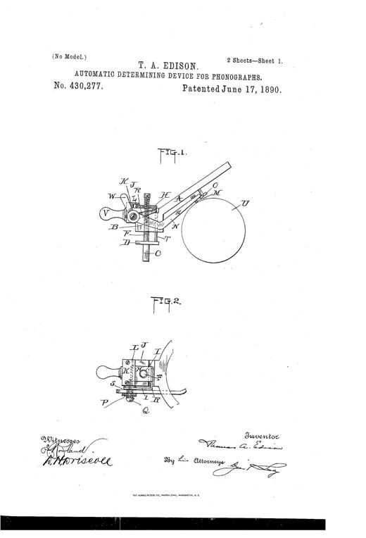 Mechanical drawing of an Edison phonograph attachment showing a spectacle-frame arm with a threaded presser-foot bar, a pivoted determining-point lever, and a locking mechanism positioned above a cylindrical phonogram-blank labeled U.