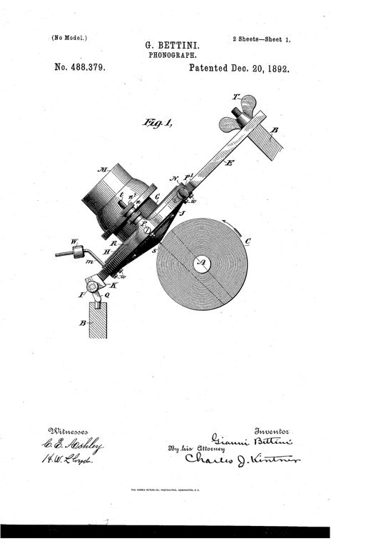 Patent drawing showing a phonograph with a large horizontal phonogram cylinder, an angled diaphragm assembly with a mouthpiece and thumb-nut adjustable arm above, and a weighted stylus support mechanism below, with labeled parts including the cylinder axis A, diaphragm ring N, and shield J.