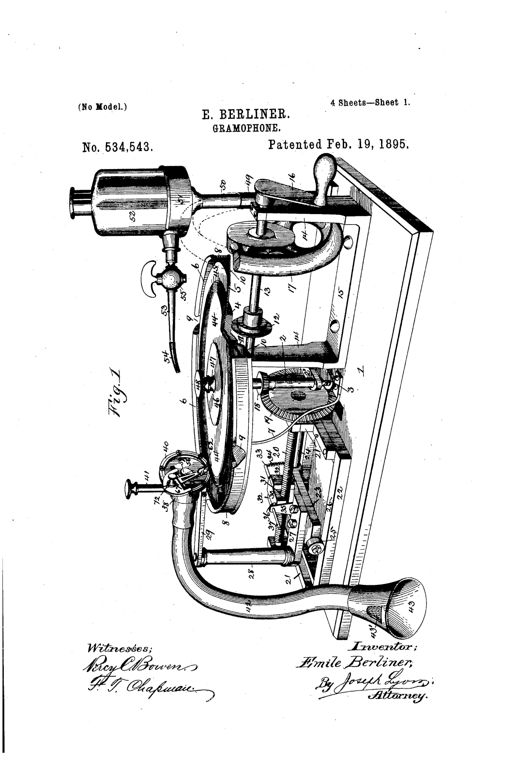 A perspective mechanical drawing of an early disc gramophone recorder showing a flat horizontal disc mounted on an upright shaft, a hand crank and flywheel driving the mechanism via gears and a screw-threaded shaft, a diaphragm and stylus assembly on an arm above the disc, and a flexible tube leading to a flaring alcohol reservoir and a curved sound-conveying tube ending in a bell-shaped mouth-piece.